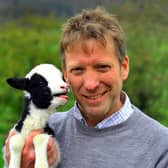 Pictured, one of the Yorkshire Vets Julian Norton with a newborn lamb at Cannon Hall Farm near Barnsley where Springtime on the Farm is being filmed, by Leeds-based Daisybeck Studios, for Channel Five. Photo credit: Gary Longbottom/ 	JPIMedia Resell