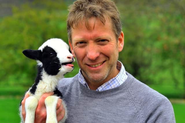 Pictured, one of the Yorkshire Vets Julian Norton with a newborn lamb at Cannon Hall Farm near Barnsley where Springtime on the Farm is being filmed, by Leeds-based Daisybeck Studios, for Channel Five. Photo credit: Gary Longbottom/ JPIMedia Resell