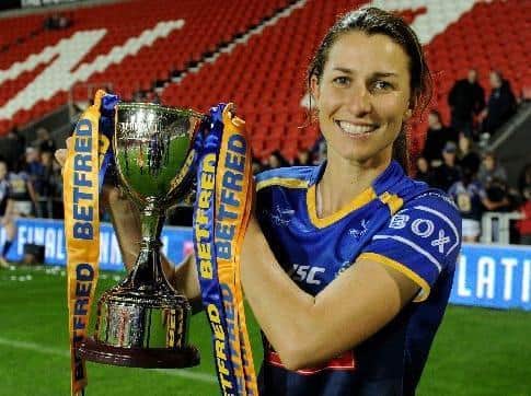 Courtney Hill with the Betfred Women's Super League trophy. Picture by Steve Riding.