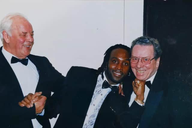 John Morgan (right) pictured with Leeds United legend John Charles and boxer Nigel Benn.