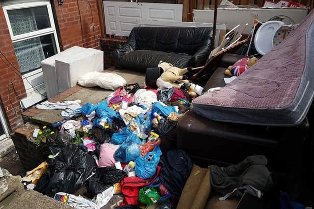 The Harehills garden was filled with old furniture and bags of rubbish. This is the before picture. Photo: WYP.