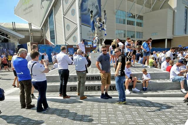PILGRIMAGE - Leeds United fans flock to the Billy Bremner statue on matchdays. Pic: Tony Johnson