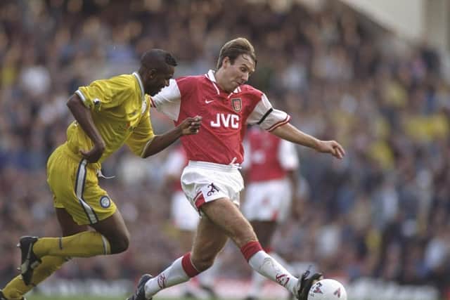 MEMORIES: Arsenal's Paul Merson looks to stave off the attentions of Leeds United's Lucas Radebe in the 3-0 loss at Highbury in the Premier League clash of October 1996. Picture by Shaun Botterill/Allsport