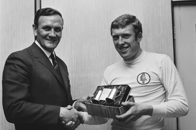 BIG SIGNING - Leeds United boss Don Revie presenting an award to Mick Jones, in 1969. Pic: Getty