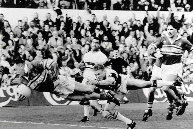 Wearing Leeds' Youngsters-sponsored kit, Garry Schofield scores against Castleford at Headingley. Picture by Steve Riding.