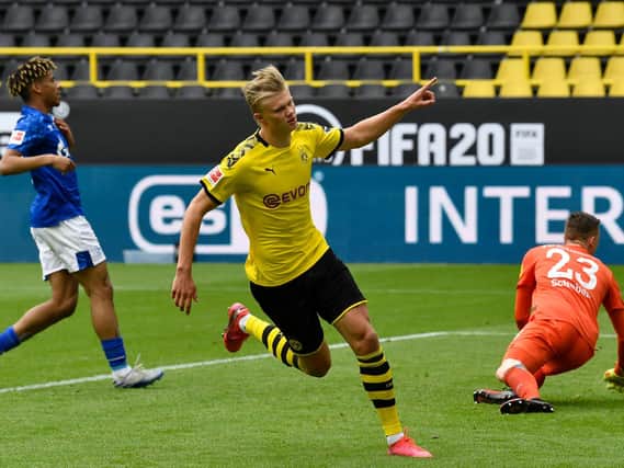 GOAL MACHINE - Erling Haaland scored in front of empty stands as Borussia Dortmund beat Schalke 4-0 in football's return. Pic: Getty