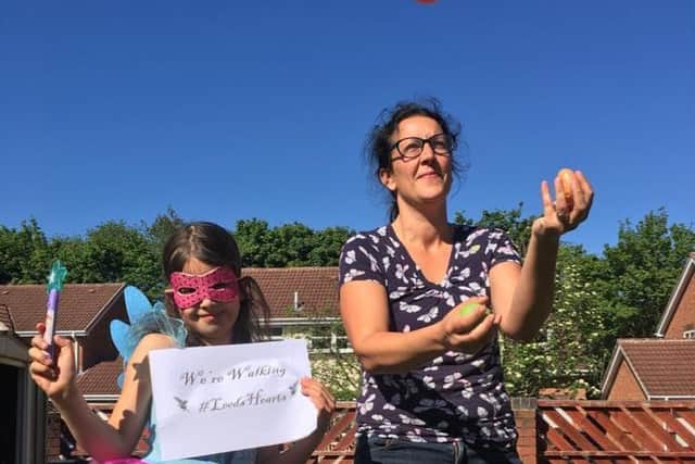 Dr Madeleine Vass, a doctor on the congenital heart unit at Leeds General Infirmary, with daughter Kaitlyn, doing the #LeedsHearts challenge.