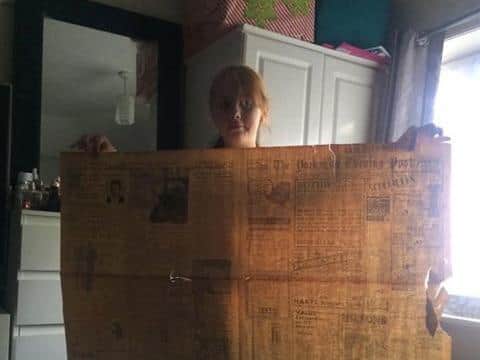 The paper is a very large broadsheet format.
