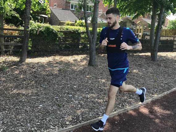 RUNNING CLUB - Leeds United midfielder Mateusz Klich running on the track at Thorp Arch today. Pic: Leeds United