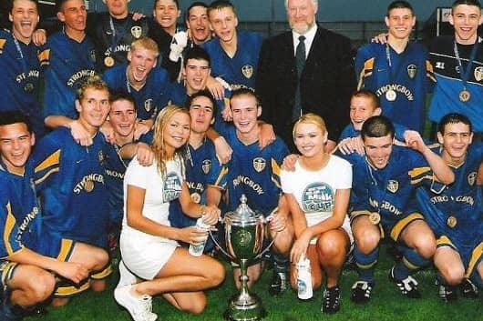 CHAMPIONS - Leeds United Under 16s, featuring Henry McStay, centre with cup, and James Milner, back second from right, won the Milk Cup's Premier Section in 2002. Pic: SuperCupNI