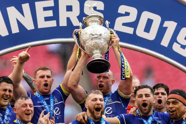 Warrington's players lift the Challenge Cup at Wembley last year. Paul Harding/PA Wire.