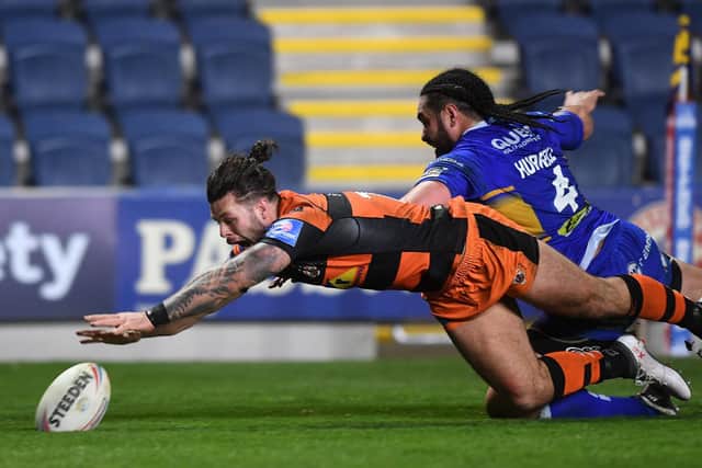 Alex Foster scores for Tigers at Leeds last April, his final match before a year-long layoff. Picture by Jonathan Gawthorpe.