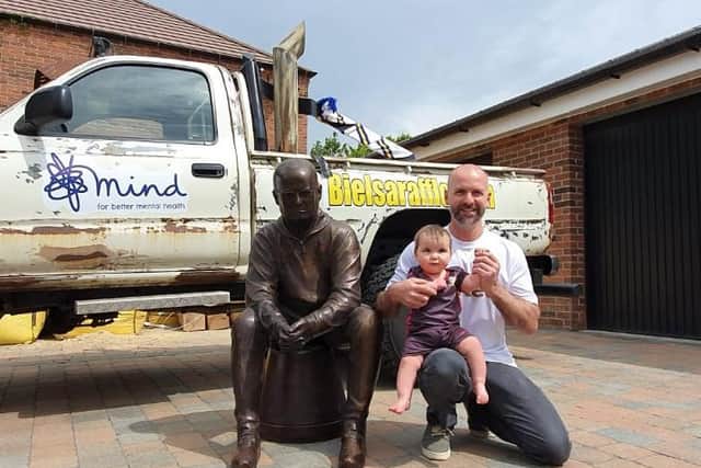 Tony Clark, 44, with the life-sized Bielsa statue