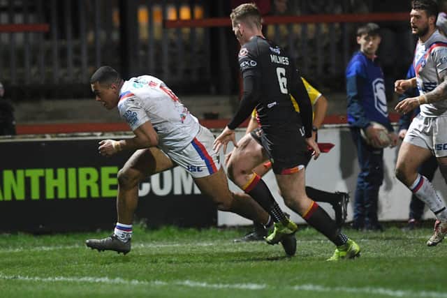 Reece Lyne scores in Wakefield Trinity's Cup win over Bradford Bulls on March 13, their last game before the shutdown. Picture by Jonathan Gawthorpe.