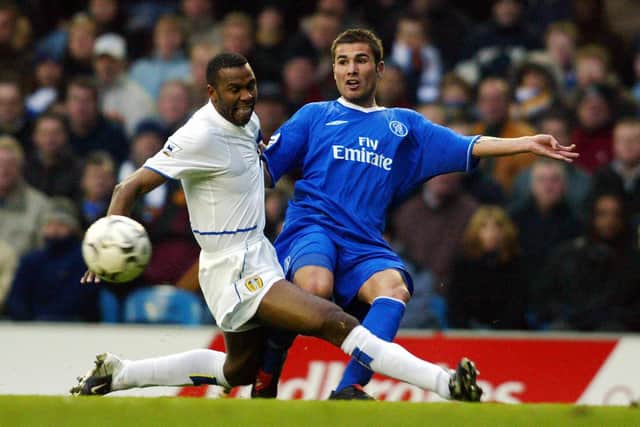 LONG WAIT: Lucas Radebe duels with Chelsea's Adrian Mutu at Elland Road during Leeds United's most recent season in the Premier League in 2003-04. Photo by STEVE PARKIN/AFP via Getty Images.