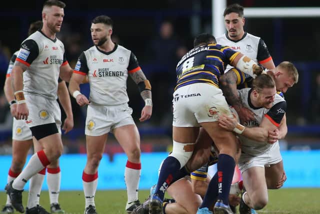 Ava Seumanufagai and Mikolaj Oledzki get to grips with former Leeds forward Anthony Mullally during Rhinos' big win over Toronto two months ago. Picture by Toronto Wolfpack.