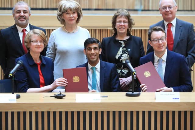 back row, left to right) Councillors Shabir Pandor, Denise Jeffery, Judith Blake and Tim Swift, (front row, left to right) Susan Hinchcliffe, Chancellor Rishi Sunak and Simon Clarke MP after the signing of the West Yorkshire Combined Authority devolution, at the Nexus Building at the University of Leeds. Photo: Danny Lawson/PA Wire