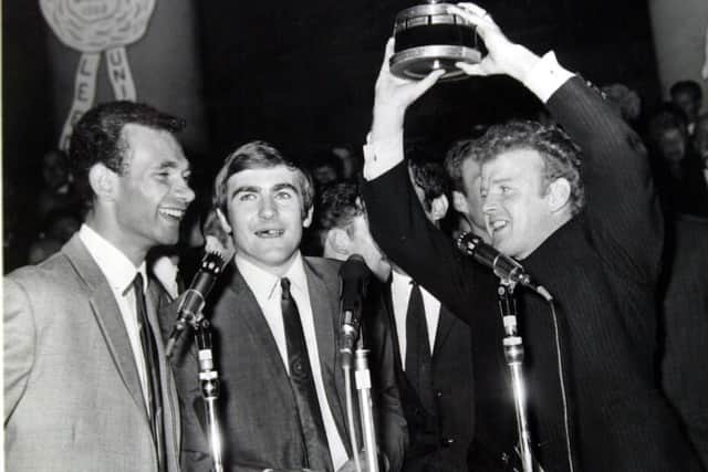 CHAMPIONS - Paul Reaney, Terry Cooper and Billy Bremner celebrate their Fairs Cup triumph