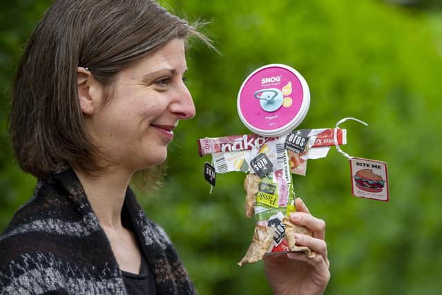 Leeds artist Dawn Woolley with one of her previous 'relics' made from household rubbish. Picture: Tony Johnson