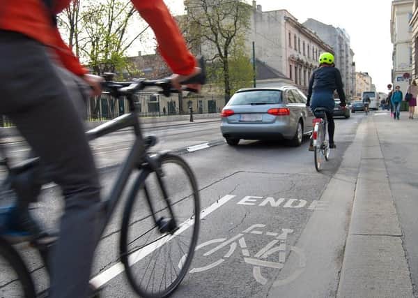 How can the road safety risks to cyclists be reduced?