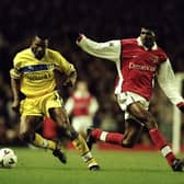TACKLING THE BEST: Lucas Radebe turns away from Arsenal's Nwankwo Kanu during Leeds United's Premier League clash against Arsenal at Highbury in December 1999. Picture by Ben Radford/Allsport.