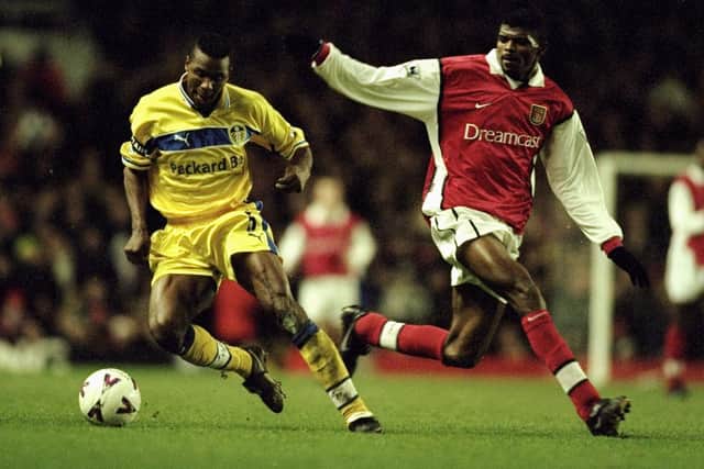 TACKLING THE BEST: Lucas Radebe turns away from Arsenal's Nwankwo Kanu during Leeds United's Premier League clash against Arsenal at Highbury in December 1999. Picture by Ben Radford/Allsport.