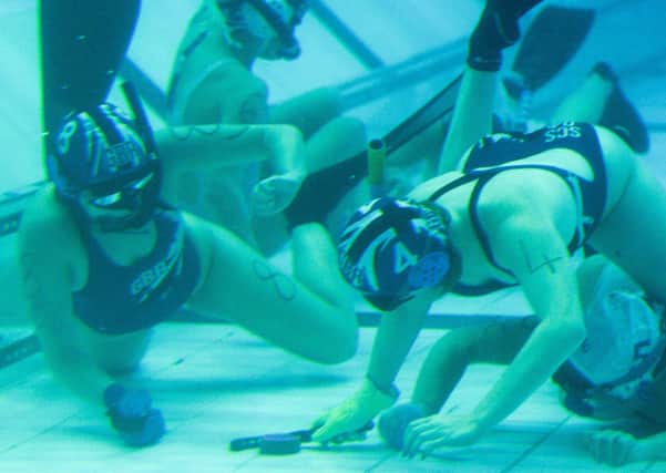 In the depths: Action from last year’s Underwater Hockey Age Group World Championships at Ponds Forge in Sheffield as Great Britain played Colombia. Inset, the scene at Ponds Forge. (Picture: Dean Atkins)