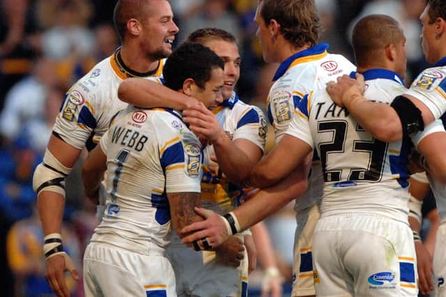 Leeds Rhinos players celebrate with Brent Webb after he scored his second try against Warrington in 2007. Picture: PA.