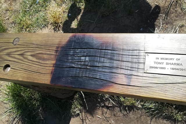 A disposable barbecue damaged Tony Sharma's memorial bench on Surprise View onthe Otley Chevin. Photo provided by Claire Sharma.