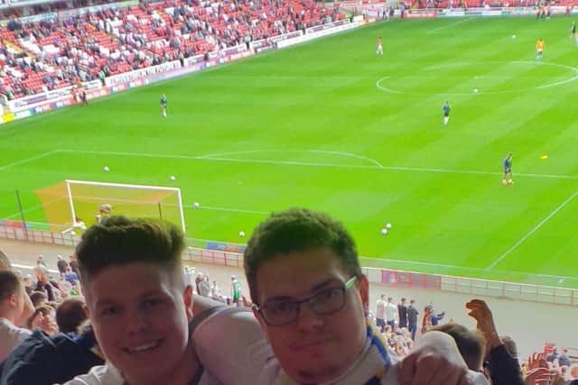US AGAINST THE WORLD: Tom Townend, left, and his brother at Barnsley away in September.