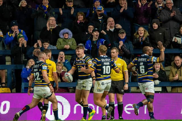 Rhinos' Harry Newman, second left, celebrates scoring against Hull KR this season. Picture by Bruce Rollinson.