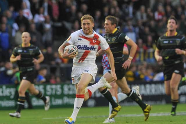 England's Sam Tomkins makes a break against the Exiles in 2013. Picture: Michelle Adamson.