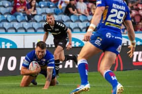 Tom Briscoe scores for Rhinos against Huddersfield last August, seconds before limping off with serious knee damage. Picture by Bruce Rollinson.