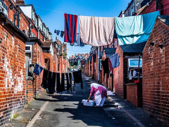 A lady pegging her washing out during the coronavirus lockdown pictured in Leeds.