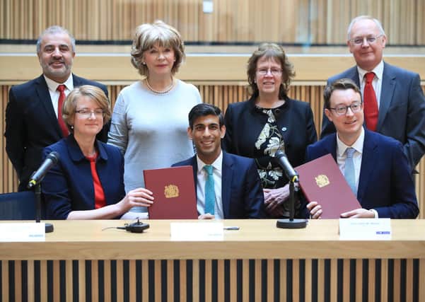 West Yorkshire's council leaders with Chancellor Rishi Sunak, and Simon Clarke, the Local Government Minister, as the area's devolution deal is signed.