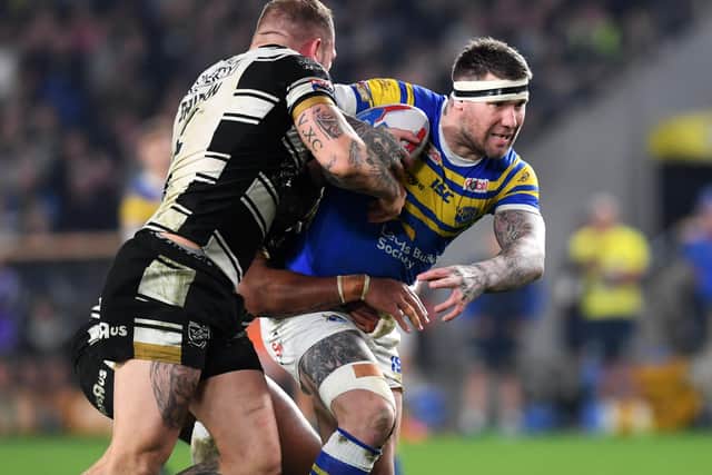 Leeds Rhinos' Brett Delaney is tackled by Hull's Mickey Paea and Josh Griffin.
 
Picture: Jonathan Gawthorpe.