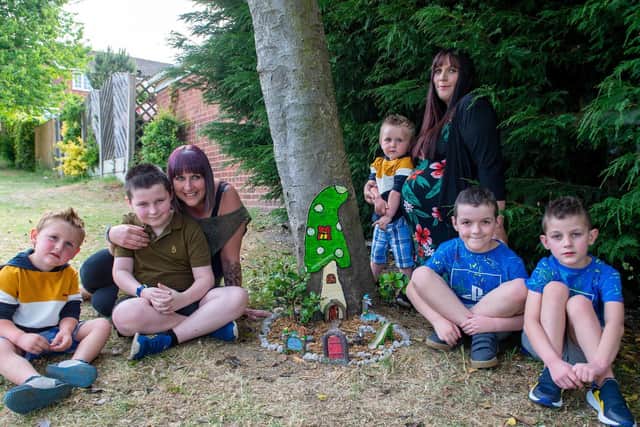 Charlotte Smith, 29, with her boys Nico, eight, Drewie, seven, James, three, and Evan, 18 months,, and her sister Sheree Smith, 39, with her son Alfie, 10, pictured with the fairy doors at Rodley Park. Picture: Bruce Rollinson