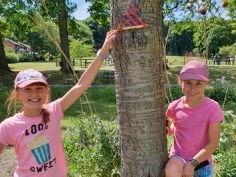 Poppy, 10, and Holly Penman, nine, with the 102nd fairy door at Rodley Park.
