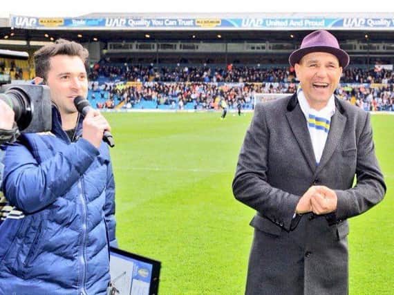SONG REQUEST - Rich Williams, left, asking ex Leeds United player Vinnie Jones to sing at Elland Road