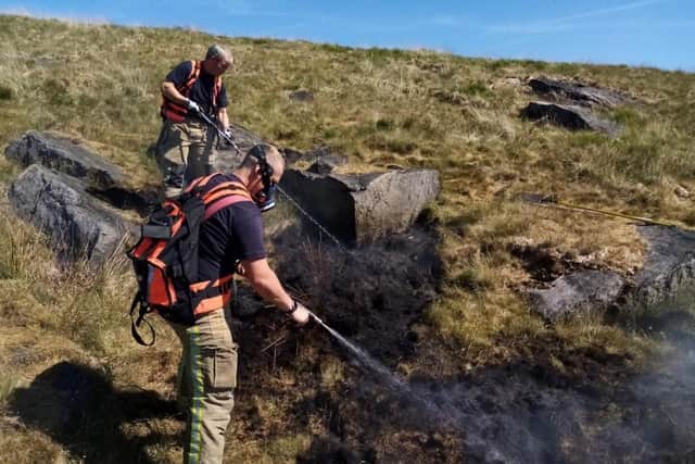 Fire services battle a grass fire in West Yorkshire this week, at which the remnants of a disposable barbecue were found. Picture: WYFRS