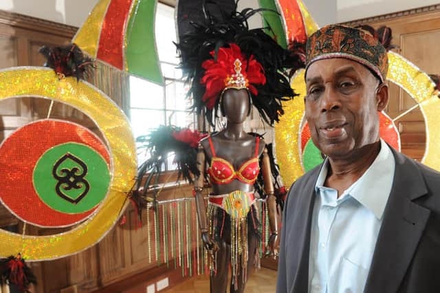 Arthur France, founder and chairman of Leeds West Indian Carnival with one of the costumes on display at the West Indian Carnival exhibition at The Tetley in 2017. Photo: Steve Riding