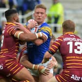Mikolaj Oledzki is held by Kruise Leeming and Ryan Hinchcliffe during the clash between 
Leeds Rhinos and Huddersfield Giants on this day in 2018. Picture: Bruce Rollinson.