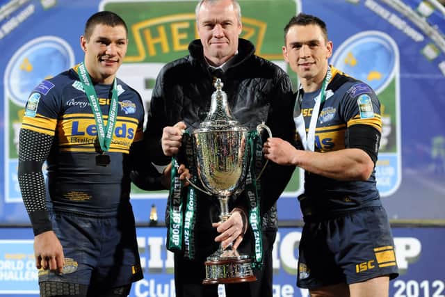 Leeds Rhinos' Ryan Hall, coach Brian McDermott and captain Kevin Sinfield with the World Club Challenge trophy after the victory over Manly Sea Eagles. Picture: Anna Gowthorpe/PA Wire.