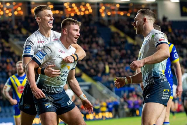 Jack Walker, centre, celebrates his try agianst Warrington with Ash Handley, left and Luke Gale. Picture by Bruce Rollinson.