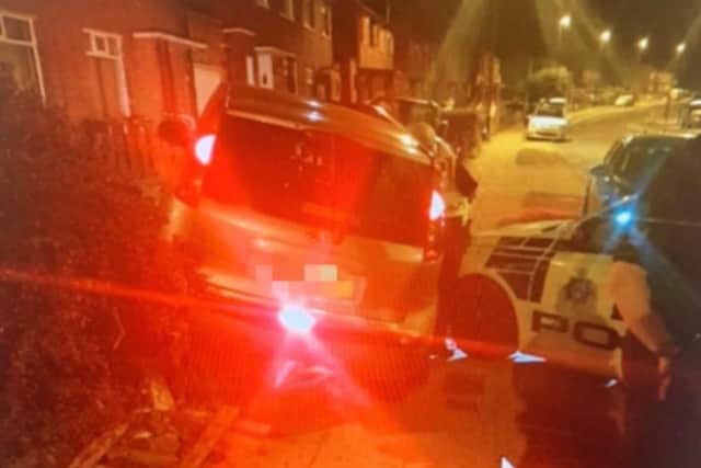 The 15-year-old crashed the car into the front garden of a home