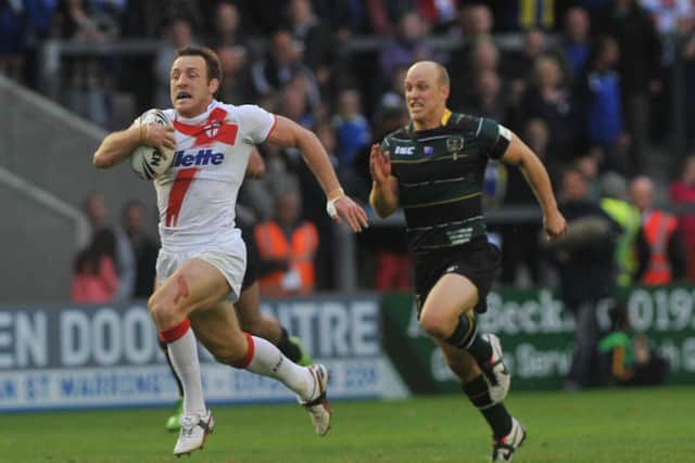 England's James Roby makes a break against the Exiles. Picture: Michelle Adamson.