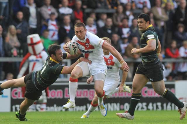 England's Kevin Sinfield on the run against the Exiles at Warrington in 2013. Picture: Michelle Adamson.