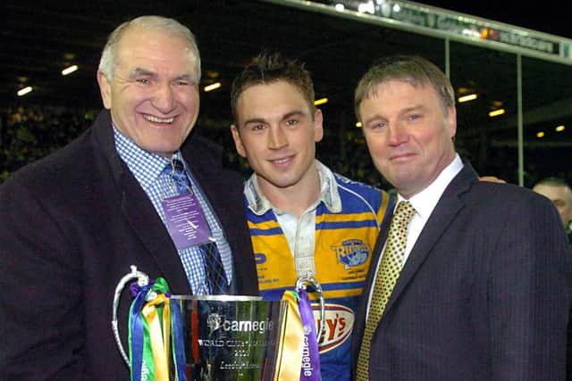 And in 2005, they were. Paul Caddick and Gary Hetherington show off the World Club Challenge trophy alongside skipper Kevin Sinfield. Picture by Steve Riding.
