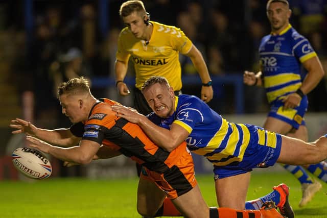 Adam Milner scores at Warirngton Wolves in last year's Super League play-offs. Picture by Bruce Rollinson.