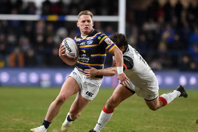 Brad Dwyer breaks a tackle in Leeds Rhinos' win over Toronto Wolfpack three months ago. Picture by Jonathan Gawthorpe.